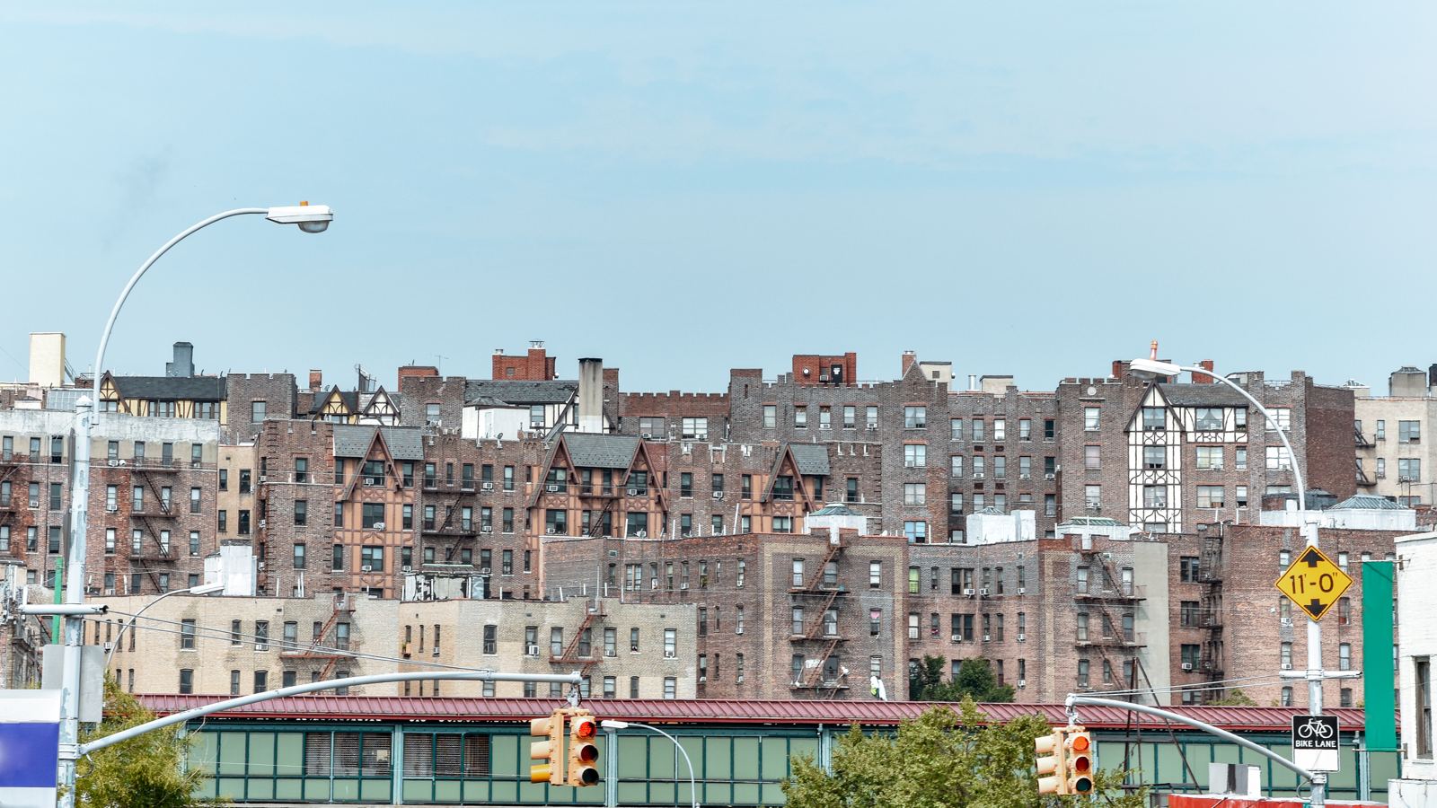 Panoramic roof view of old houses brick buildings with fire stairs during the day bronx nyc usa